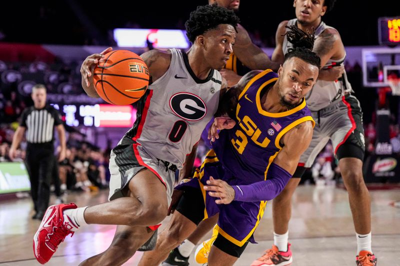 Feb 14, 2023; Athens, Georgia, USA; Georgia Bulldogs guard Terry Roberts (0) is fouled by LSU Tigers guard Justice Hill (3) during the second half at Stegeman Coliseum. Mandatory Credit: Dale Zanine-USA TODAY Sports