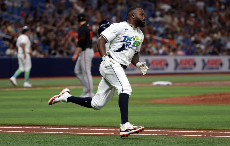 Jun 7, 2024; St. Petersburg, Florida, USA; Tampa Bay Rays outfielder Randy Arozarena (56) hits an RBI double against the Baltimore Orioles during the third inning at Tropicana Field. Mandatory Credit: Kim Klement Neitzel-USA TODAY Sports