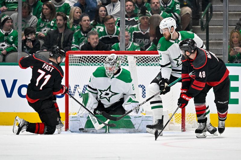 Jan 25, 2023; Dallas, Texas, USA; Dallas Stars goaltender Jake Oettinger (29) makes a save on a shot by Carolina Hurricanes right wing Jesper Fast (71) during the second period at the American Airlines Center. Mandatory Credit: Jerome Miron-USA TODAY Sports