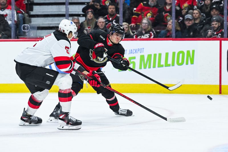 Jan 31, 2026; Ottawa, Ontario, CAN; Ottawa Senators center Tim Stutzle (18) shoots the puck against New Jersey Devils defenseman Brenden Dillon (5) during the first period at Canadian Tire Centre. Mandatory Credit: David Kirouac-Imagn Images