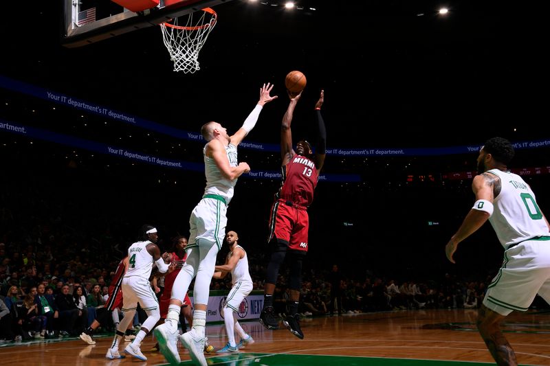 BOSTON, MA - APRIL 21: Bam Adebayo #13 of the Miami Heat shoots the ball during the game against the Boston Celtics during Round 1 Game 1 of the 2024 NBA Playoffs on April 21, 2024 at the TD Garden in Boston, Massachusetts. NOTE TO USER: User expressly acknowledges and agrees that, by downloading and or using this photograph, User is consenting to the terms and conditions of the Getty Images License Agreement. Mandatory Copyright Notice: Copyright 2024 NBAE  (Photo by Brian Babineau/NBAE via Getty Images)