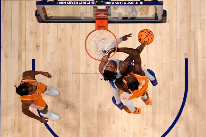 Mar 16, 2025; Nashville, TN, USA; Florida Gators guard Will Richard (5) shoots the ball on Tennessee Volunteers forward Felix Okpara (34) during the first half at the 2025 SEC Championship Game at Bridgestone Arena. Mandatory Credit: Steve Roberts-Imagn Images