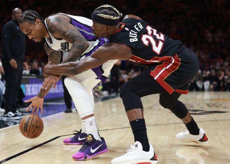 MIAMI, FLORIDA - NOVEMBER 04: Jimmy Butler #22 of the Miami Heat defends against DeMar DeRozan #10 of the Sacramento Kings during the first half at Kaseya Center on November 04, 2024 in Miami, Florida. NOTE TO USER: User expressly acknowledges and agrees that, by downloading and or using this Photograph, user is consenting to the terms and conditions of the Getty Images License Agreement. (Photo by Carmen Mandato/Getty Images)