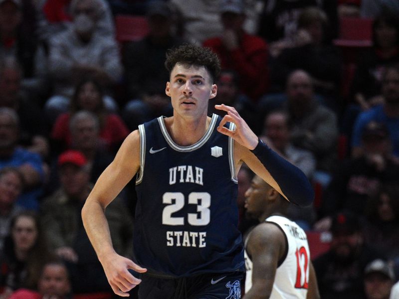 Jan 25, 2023; San Diego, California, USA; Utah State Aggies forward Taylor Funk (23) gestures after a three-point basket against the San Diego State Aztecs during the first half at Viejas Arena. Mandatory Credit: Orlando Ramirez-USA TODAY Sports