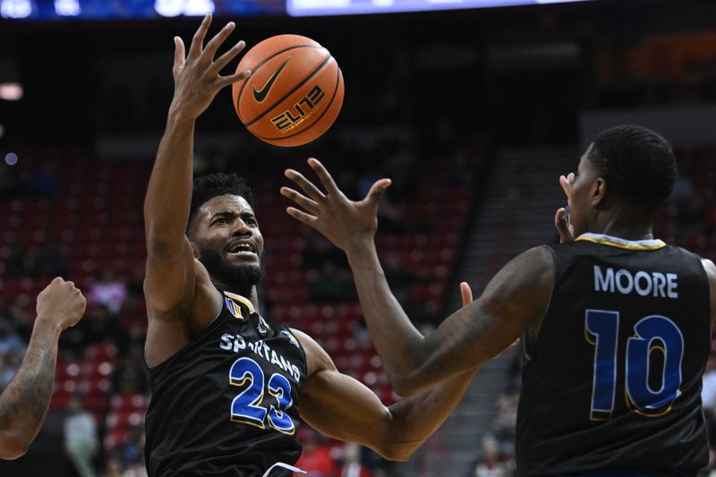 Feb 14, 2023; Las Vegas, Nevada, USA; San Jose State Spartans forward Sage Tolbert III (23) and guard Omari Moore (10) try and haul in a loose ball against the UNLV Runnin' Rebels in the second half at Thomas & Mack Center. Mandatory Credit: Candice Ward-USA TODAY Sports