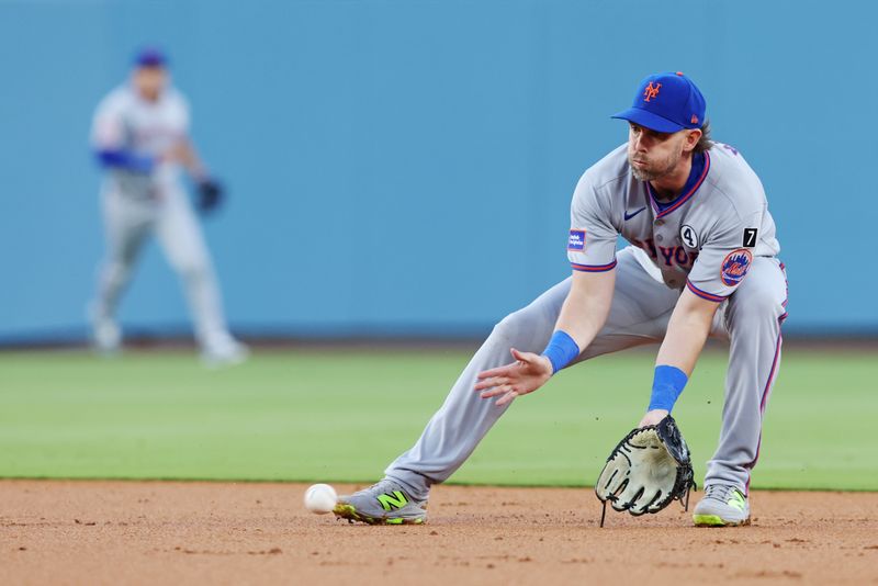 Jun 2, 2025; Los Angeles, California, USA; New York Mets second base Jeff McNeil (1) fields a grounder during the second inning against the Los Angeles Dodgers during the third inning against the New York Mets at Dodger Stadium. Mandatory Credit: Jason Parkhurst-Imagn Images