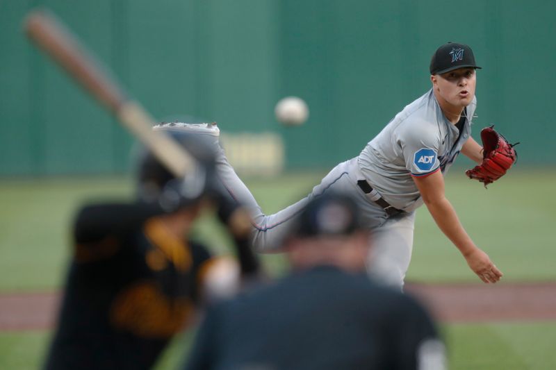 Sep 9, 2024; Pittsburgh, Pennsylvania, USA;  Miami Marlins starting pitcher Valente Bellozo (83) pitches to Pittsburgh Pirates second baseman Nick Gonzales (39) during the first inning at PNC Park. Mandatory Credit: Charles LeClaire-Imagn Images