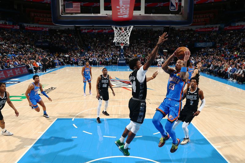 OKLAHOMA CITY, OK - DECEMBER 27: Tre Mann #23 of the Oklahoma City Thunder shoots the ball against the San Antonio Spurs on December 27, 2022 at Paycom Arena in Oklahoma City, Oklahoma. NOTE TO USER: User expressly acknowledges and agrees that, by downloading and or using this photograph, User is consenting to the terms and conditions of the Getty Images License Agreement. Mandatory Copyright Notice: Copyright 2022 NBAE (Photo by Zach Beeker/NBAE via Getty Images)