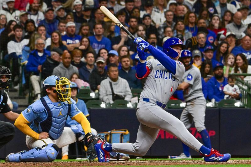May 2, 2025; Milwaukee, Wisconsin, USA;  Chicago Cubs center fielder Pete Crow-Armstrong (4) hits a solo home run in the seventh inning against the Milwaukee Brewers at American Family Field. Mandatory Credit: Benny Sieu-Imagn Images