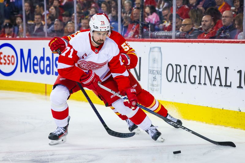 Feb 17, 2024; Calgary, Alberta, CAN; Detroit Red Wings center Dylan Larkin (71) and Calgary Flames defenseman Noah Hanifin (55) battles for the puck during the second period at Scotiabank Saddledome. Mandatory Credit: Sergei Belski-USA TODAY Sports