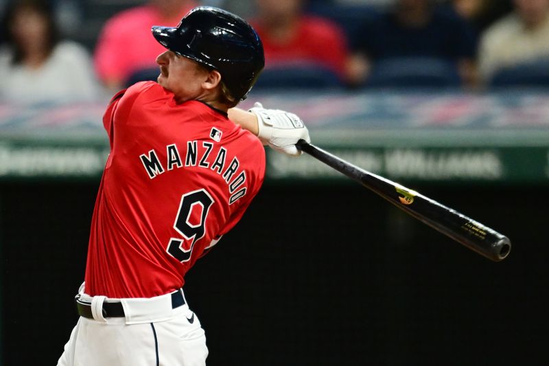 Sep 16, 2024; Cleveland, Ohio, USA; Cleveland Guardians designated hitter Kyle Manzardo (9) hits a two-run home run during the eighth inning against the Minnesota Twins at Progressive Field. Mandatory Credit: Ken Blaze-Imagn Images