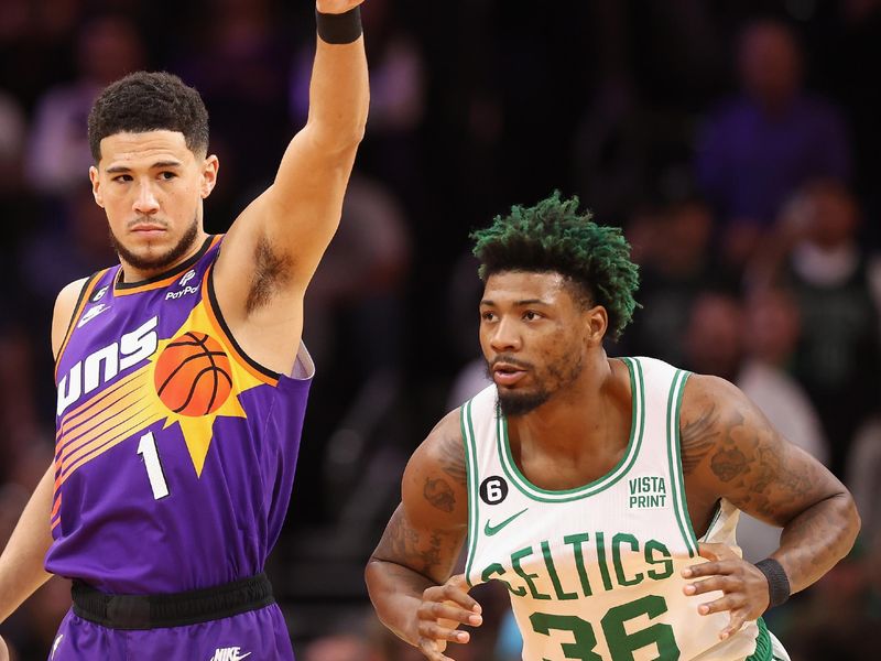 PHOENIX, ARIZONA - DECEMBER 07: Devin Booker #1 of the Phoenix Suns and Marcus Smart #36 of the Boston Celtics during the second half of the NBA game at Footprint Center on December 07, 2022 in Phoenix, Arizona. NOTE TO USER: User expressly acknowledges and agrees that, by downloading and or using this photograph, User is consenting to the terms and conditions of the Getty Images License Agreement. (Photo by Christian Petersen/Getty Images)