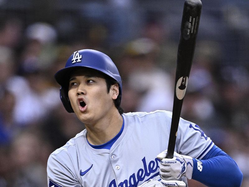 May 11, 2024; San Diego, California, USA; Los Angeles Dodgers designated hitter Shohei Ohtani (17) reacts after a walk during the sixth inning against the San Diego Padres at Petco Park. Mandatory Credit: Orlando Ramirez-USA TODAY Sports