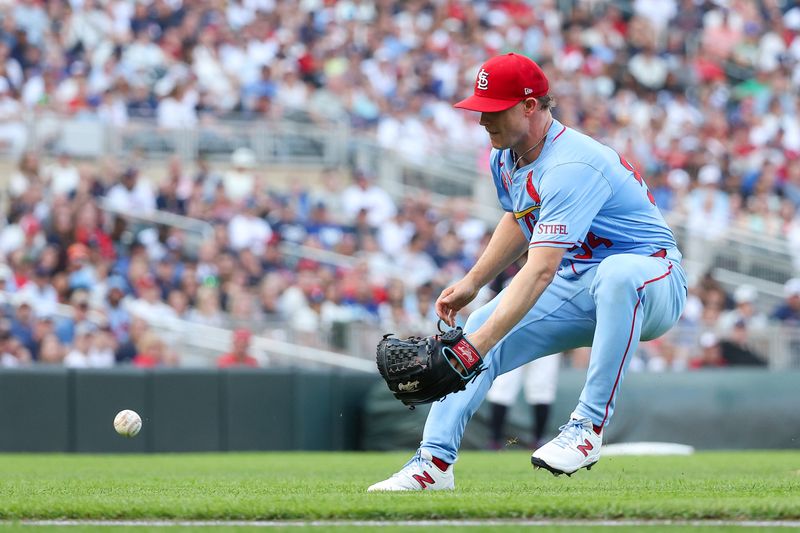 Aug 24, 2024; Minneapolis, Minnesota, USA; St. Louis Cardinals starting pitcher Sonny Gray (54) fields the ball hit by Minnesota Twins designated hitter Matt Wallner (38) during the second inning at Target Field. Mandatory Credit: Matt Krohn-USA TODAY Sports