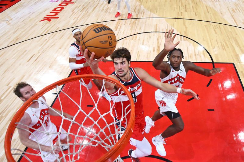 TORONTO, CANADA - OCTOBER 20: Deni Avdija #8 of the Washington Wizards drives to the basket during the game against the Toronto Raptors on October 20, 2023 at the Scotiabank Arena in Toronto, Ontario, Canada.  NOTE TO USER: User expressly acknowledges and agrees that, by downloading and or using this Photograph, user is consenting to the terms and conditions of the Getty Images License Agreement.  Mandatory Copyright Notice: Copyright 2023 NBAE (Photo by Vaughn Ridley/NBAE via Getty Images)