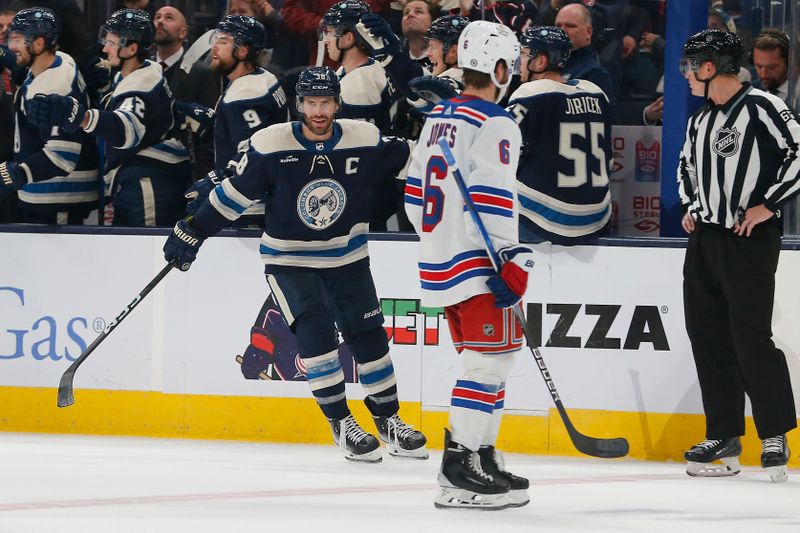 Oct 14, 2023; Columbus, Ohio, USA; Columbus Blue Jackets center Boone Jenner (38) celebrates his goal and a hat trick against the New York Rangers during the second period at Nationwide Arena. Mandatory Credit: Russell LaBounty-USA TODAY Sports