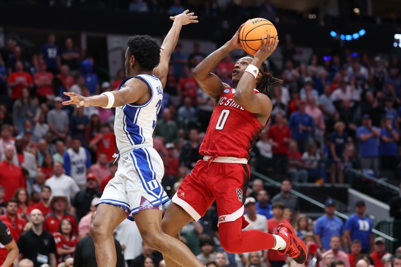 Mar 31, 2024; Dallas, TX, USA; North Carolina State Wolfpack guard DJ Horne (0) shoots against Duke Blue Devils guard Jeremy Roach (3) in the second half in the finals of the South Regional of the 2024 NCAA Tournament at American Airline Center. Mandatory Credit: Kevin Jairaj-USA TODAY Sports