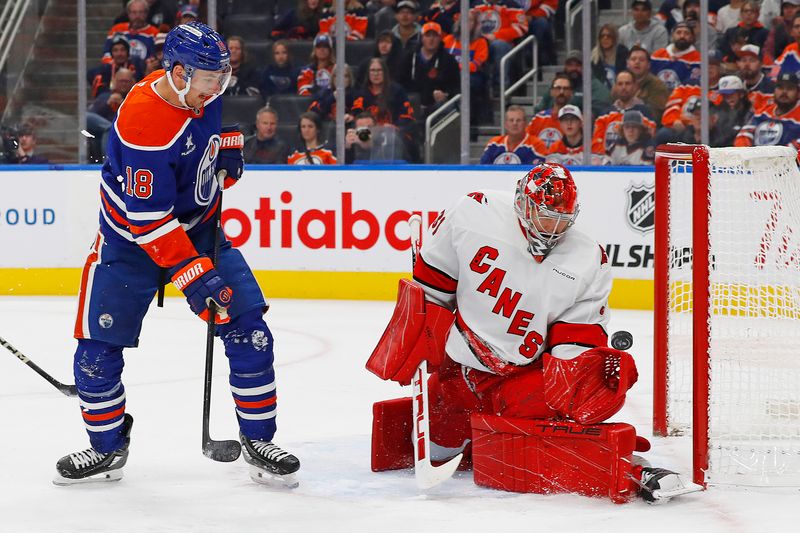 Oct 22, 2024; Edmonton, Alberta, CAN; Carolina Hurricanes goaltender Frederik Andersen (31) makes a save on a deflection by Edmonton Oilers forward Zach Hyman (18) during the first period at Rogers Place. Mandatory Credit: Perry Nelson-Imagn Images