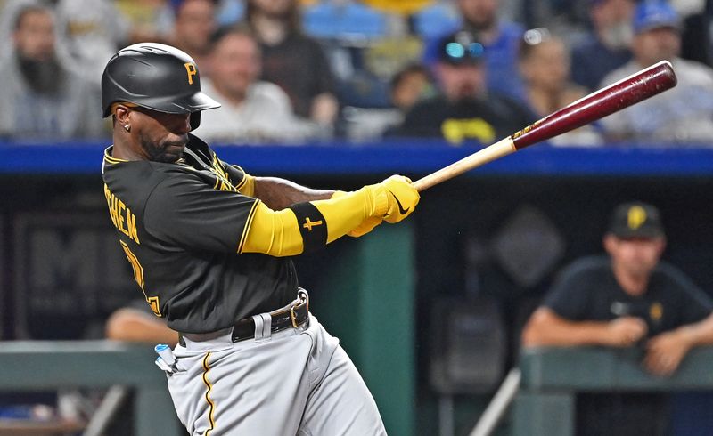 Aug 28, 2023; Kansas City, Missouri, USA;  Pittsburgh Pirates designated hitter Andrew McCutchen (22) hits an RBI single in the seventh inning against the Kansas City Royals at Kauffman Stadium. Mandatory Credit: Peter Aiken-USA TODAY Sports