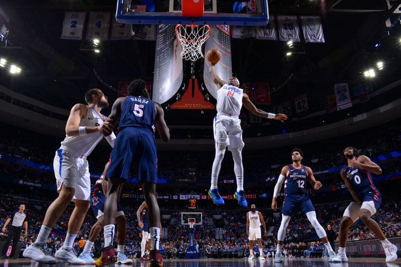 PHILADELPHIA, PA - MARCH 27: Terance Mann #14 of the LA Clippers dunks the ball during the game against the Philadelphia 76ers on March 27, 2024 at the Wells Fargo Center in Philadelphia, Pennsylvania NOTE TO USER: User expressly acknowledges and agrees that, by downloading and/or using this Photograph, user is consenting to the terms and conditions of the Getty Images License Agreement. Mandatory Copyright Notice: Copyright 2024 NBAE (Photo by Jesse D. Garrabrant/NBAE via Getty Images)