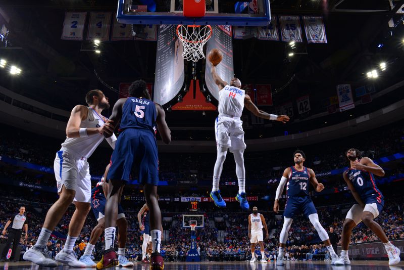 PHILADELPHIA, PA - MARCH 27: Terance Mann #14 of the LA Clippers dunks the ball during the game against the Philadelphia 76ers on March 27, 2024 at the Wells Fargo Center in Philadelphia, Pennsylvania NOTE TO USER: User expressly acknowledges and agrees that, by downloading and/or using this Photograph, user is consenting to the terms and conditions of the Getty Images License Agreement. Mandatory Copyright Notice: Copyright 2024 NBAE (Photo by Jesse D. Garrabrant/NBAE via Getty Images)