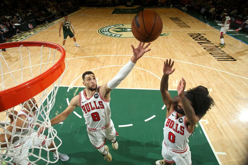 MILWAUKEE, WI - NOVEMBER 20: Zach LaVine #8 and Coby White #0 of the Chicago Bulls rebounds during the game against the Milwaukee Bucks on November 20, 2024 at the Fiserv Forum Center in Milwaukee, Wisconsin. NOTE TO USER: User expressly acknowledges and agrees that, by downloading and or using this Photograph, user is consenting to the terms and conditions of the Getty Images License Agreement. Mandatory Copyright Notice: Copyright 2024 NBAE (Photo by Gary Dineen/NBAE via Getty Images).