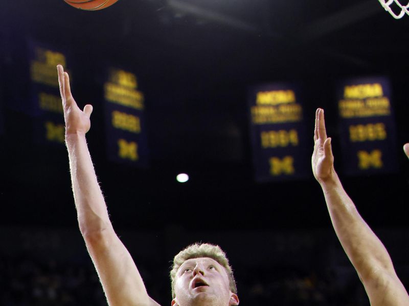 Feb 11, 2025; Ann Arbor, Michigan, USA;  Michigan Wolverines center Danny Wolf (1) shoots in the first half against the Purdue Boilermakers at Crisler Center. Mandatory Credit: Rick Osentoski-Imagn Images