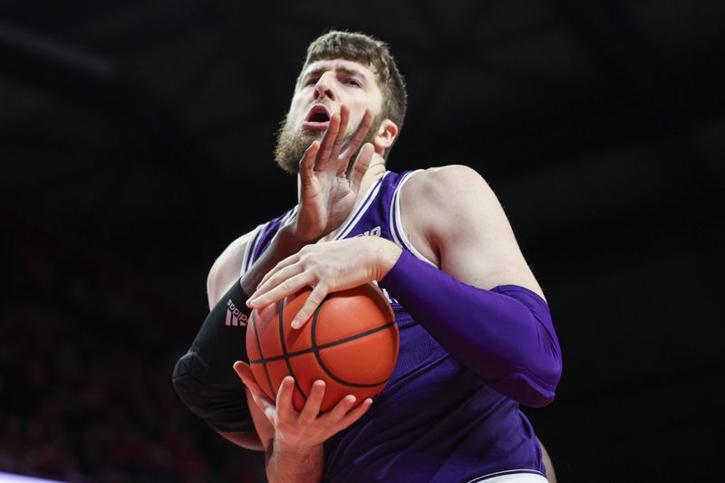 Feb 15, 2024; Piscataway, New Jersey, USA; Northwestern Wildcats center Matthew Nicholson (34) is fouled by Rutgers Scarlet Knights center Clifford Omoruyi (11) during the first half at Jersey Mike's Arena. Mandatory Credit: Vincent Carchietta-USA TODAY Sports