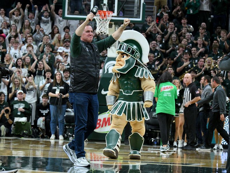 Dec 2, 2025; East Lansing, Michigan, USA;  MSU’s new head football coach Pat Fitzpatrick incites the crowd at Jack Breslin Student Events Center. Mandatory Credit: Dale Young-Imagn Images