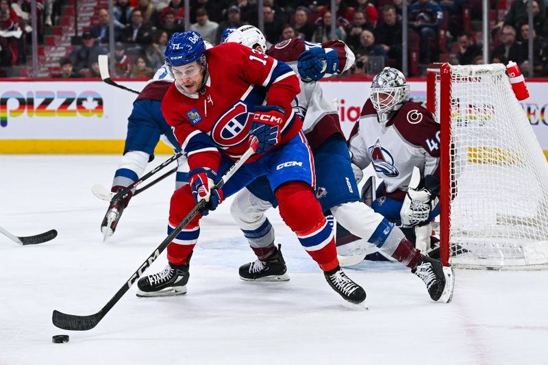 Jan 15, 2024; Montreal, Quebec, CAN; Montreal Canadiens center Mitchell Stephens (13) plays the puck near Colorado Avalanche goalie Alexandar Georgiev (40) net during the first period at Bell Centre. Mandatory Credit: David Kirouac-USA TODAY Sports