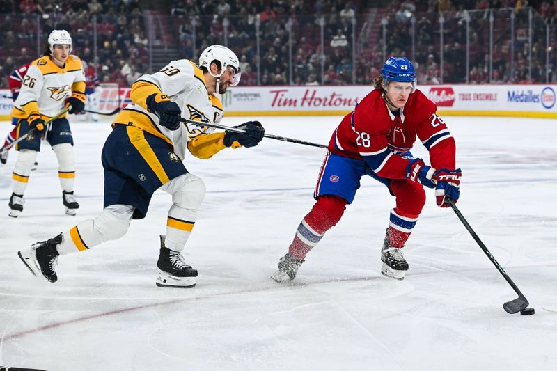 Dec 10, 2023; Montreal, Quebec, CAN; Montreal Canadiens center Christian Dvorak (28) plays the puck against Nashville Predators defenseman Roman Josi (59) during the first period at Bell Centre. Mandatory Credit: David Kirouac-USA TODAY Sports