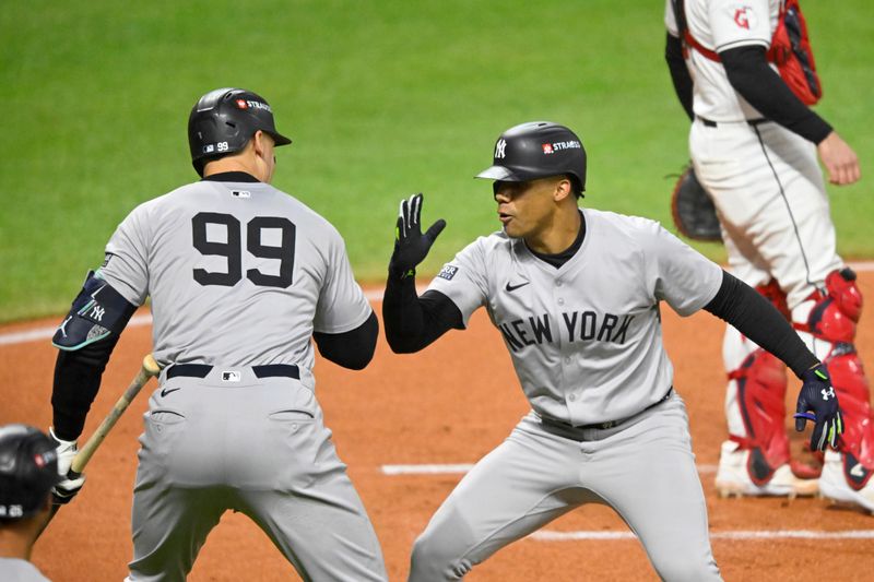 Oct 18, 2024; Cleveland, Ohio, USA; New York Yankees outfielder Juan Soto (22) celebrates after hitting a two run home run with outfielder Aaron Judge (99) in the first inning against the Cleveland Guardians during game four of the ALCS for the 2024 MLB playoffs at Progressive Field. Mandatory Credit: David Richard-Imagn Images