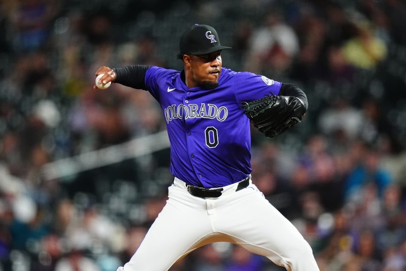 Sep 17, 2024; Denver, Colorado, USA; Colorado Rockies relief pitcher Jaden Hill (0) delivers a pitch in the eighth inning against the Arizona Diamondbacks at Coors Field. Mandatory Credit: Ron Chenoy-Imagn Images