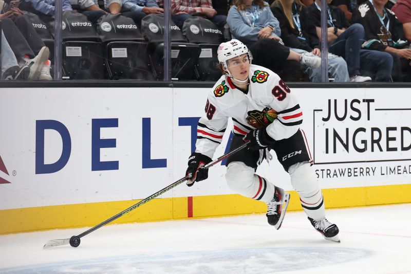 Oct 8, 2024; Salt Lake City, Utah, USA; Utah Hockey Club defenseman Mikhail Sergachev (98) passes the puck against the Utah Hockey Club during the third period at Delta Center. Mandatory Credit: Rob Gray-Imagn Images