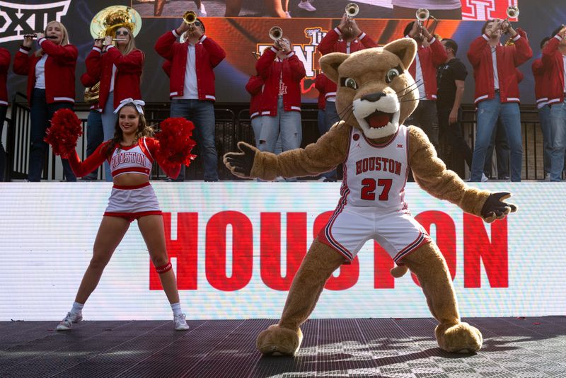 Mar 15, 2024; Kansas City, MO, USA; Houston Cougars cheer squad performs for the pep rally outside the T-Mobile Center. Mandatory Credit: William Purnell-USA TODAY Sports