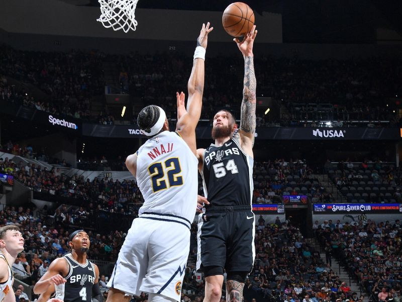 SAN ANTONIO, TX - APRIL 12:  Sandro Mamukelashvili #54 of the San Antonio Spurs  goes to the basket during the game on April 12, 2024 at the Frost Bank Center in San Antonio, Texas. NOTE TO USER: User expressly acknowledges and agrees that, by downloading and or using this photograph, user is consenting to the terms and conditions of the Getty Images License Agreement. Mandatory Copyright Notice: Copyright 2024 NBAE (Photos by Michael Gonzales/NBAE via Getty Images)