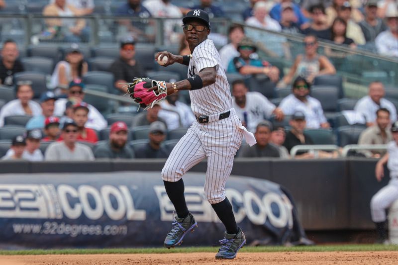 Aug 4, 2024; Bronx, New York, USA;  New York Yankees third baseman Jazz Chisholm Jr. (13) throws the ball to first base for an out during the third inning against the Toronto Blue Jays at Yankee Stadium. Mandatory Credit: Vincent Carchietta-USA TODAY Sports