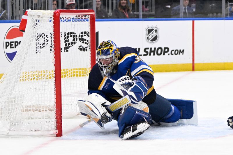 Jan 28, 2024; St. Louis, Missouri, USA; St. Louis Blues goaltender Joel Hofer (30) makes a save against the Los Angeles Kings during the third period at Enterprise Center. Mandatory Credit: Jeff Le-USA TODAY Sports