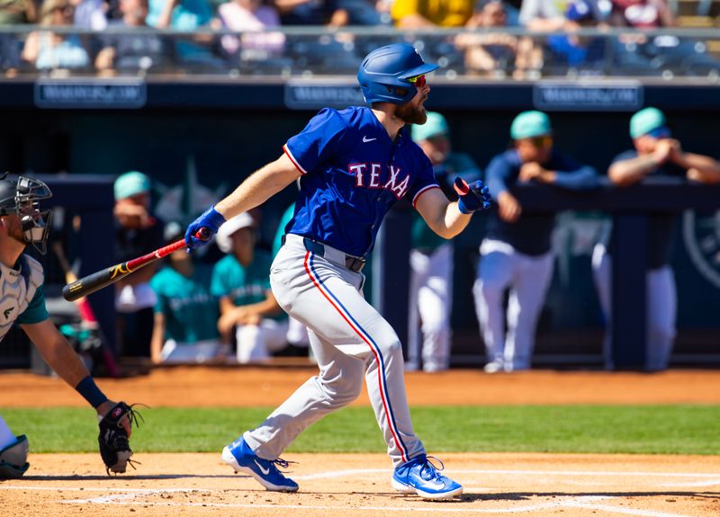 Mar 5, 2024; Peoria, Arizona, USA; Texas Rangers infielder Jared Walsh against the Seattle Mariners during a spring training baseball game at Peoria Sports Complex. Mandatory Credit: Mark J. Rebilas-USA TODAY Sports