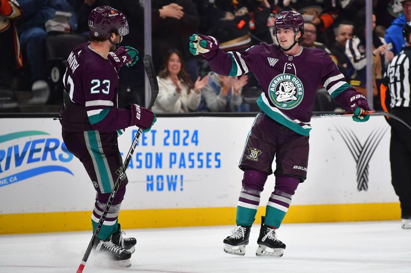 Dec 27, 2023; Anaheim, California, USA; Anaheim Ducks defenseman Jamie Drysdale (6) celebrates his goal scored against the Vegas Golden Knights with center Mason McTavish (23) during the first period at Honda Center. McTavish provided an assist on the goal. Mandatory Credit: Gary A. Vasquez-USA TODAY Sports