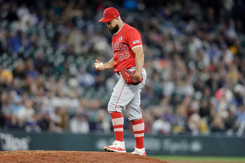 Jun 2, 2024; Seattle, Washington, USA; Los Angeles Angels pitcher Luis García (66) on the mound after hitting a batter with the bases loaded and scoring a run against the Seattle Mariners during the eighth inning at T-Mobile Park. Mandatory Credit: John Froschauer-USA TODAY Sports