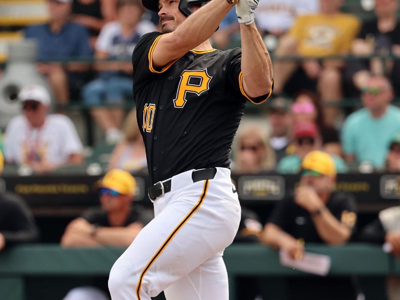 Mar 1, 2024; Bradenton, Florida, USA; Pittsburgh Pirates left fielder Bryan Reynolds (10) hits a home run during the first inning against the Tampa Bay Rays at LECOM Park. Mandatory Credit: Kim Klement Neitzel-USA TODAY Sports
