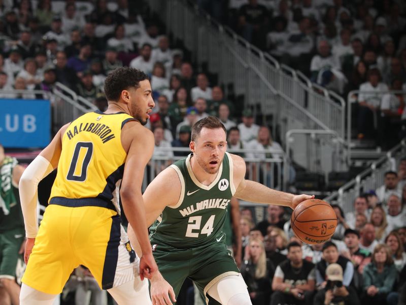 MILWAUKEE, WI - APRIL 23: Pat Connaughton #24 of the Milwaukee Bucks handles the ball during the game against the Indiana Pacers during Round One Game Two of the 2024 NBA Playoffs on April 23, 2024 at the Fiserv Forum Center in Milwaukee, Wisconsin. NOTE TO USER: User expressly acknowledges and agrees that, by downloading and or using this Photograph, user is consenting to the terms and conditions of the Getty Images License Agreement. Mandatory Copyright Notice: Copyright 2024 NBAE (Photo by Gary Dineen/NBAE via Getty Images).