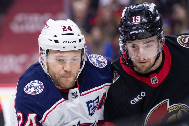 Dec 29, 2025; Ottawa, Ontario, CAN; Columbus Blue Jackets right wing Mathieu Olivier (24) battles with Ottawa Senators right wing Drake Batherson (19) in the second period at the Canadian Tire Centre. Mandatory Credit: Marc DesRosiers-IMAGN Images