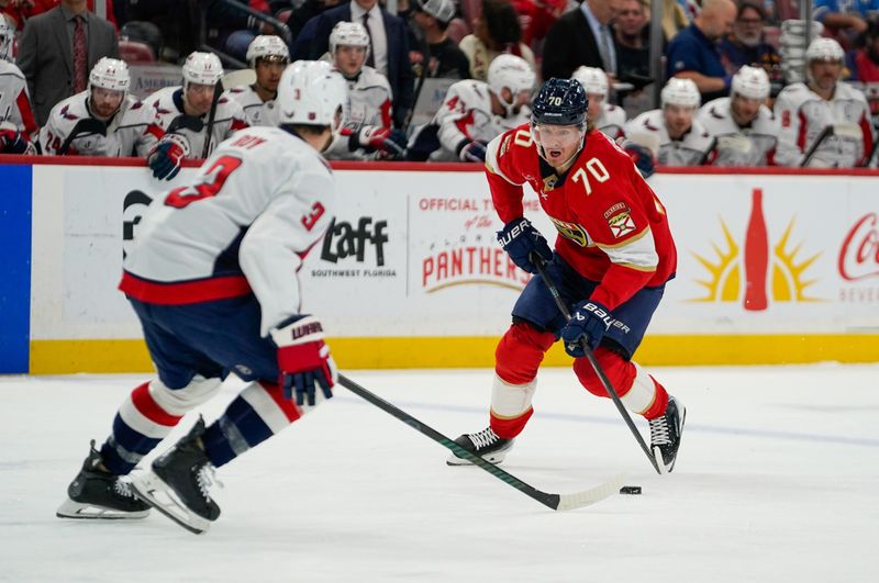 Dec 29, 2025; Sunrise, Florida, USA; Florida Panthers center Jesper Boqvist (70) moves the puck against the Washington Capitals during the first period at Amerant Bank Arena. Mandatory Credit: Jeff Romance-Imagn Images