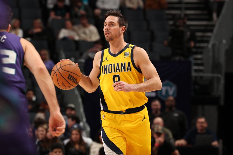 CHARLOTTE, NC - February 12: T.J. McConnell #9 of the Indiana Pacers handles the ball during the game against the Charlotte Hornets on February 12, 2024 at Spectrum Center in Charlotte, North Carolina. NOTE TO USER: User expressly acknowledges and agrees that, by downloading and or using this photograph, User is consenting to the terms and conditions of the Getty Images License Agreement. Mandatory Copyright Notice: Copyright 2024 NBAE (Photo by Kent Smith/NBAE via Getty Images)