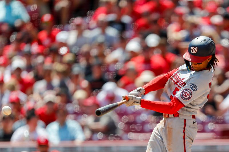 Aug 6, 2023; Cincinnati, Ohio, USA; Washington Nationals shortstop CJ Abrams (5) hits a single against the Cincinnati Reds in the fourth inning at Great American Ball Park. Mandatory Credit: Katie Stratman-USA TODAY Sports