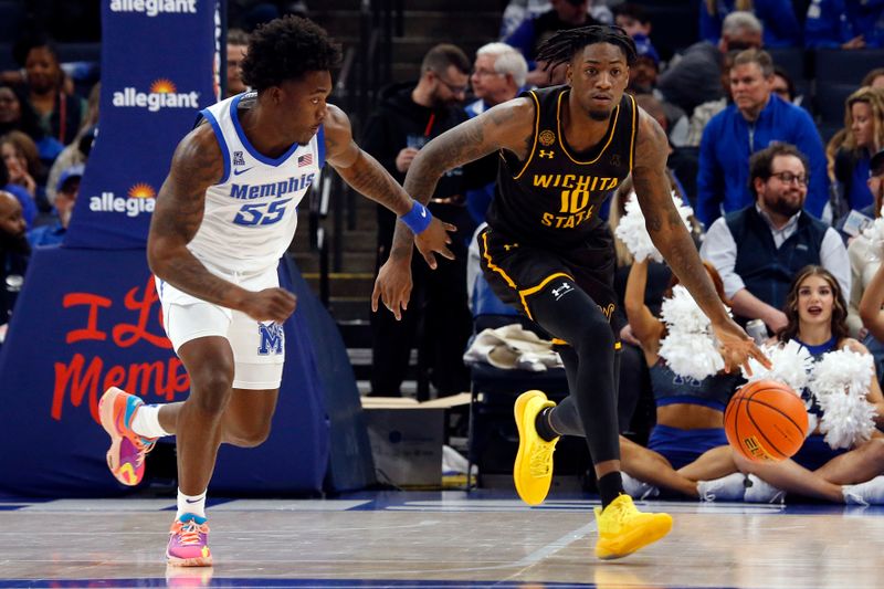 Jan 19, 2023; Memphis, Tennessee, USA; Wichita State Shockers guard Jaykwon Walton (10) dribbles up the court as Memphis Tigers guard Damaria Franklin (55) defends during the first half at FedExForum. Mandatory Credit: Petre Thomas-USA TODAY Sports