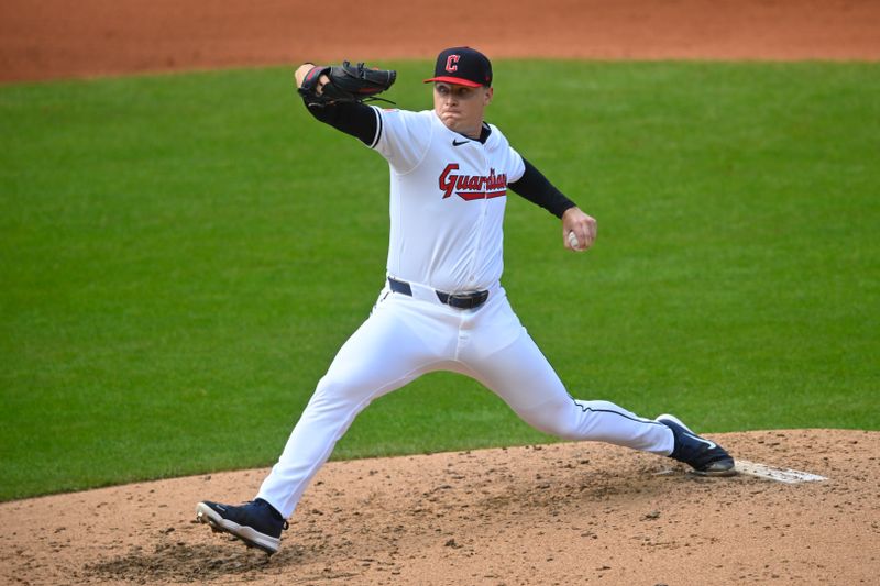 Oct 12, 2024; Cleveland, Ohio, USA; Cleveland Guardians relief pitcher Erik Sabrowski (62) pitches in the fourth inning against the Detroit Tigers during game five of the ALDS for the 2024 MLB Playoffs at Progressive Field. Mandatory Credit: David Richard-Imagn Images