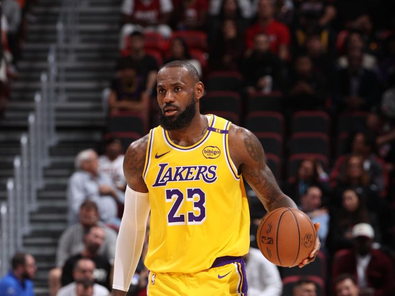 MIAMI, FL - DECEMBER 4:  LeBron James #23 of the Los Angeles Lakers handles the ball during the game against the Miami Heat on December 4, 2024 at Kaseya Center in Miami, Florida. NOTE TO USER: User expressly acknowledges and agrees that, by downloading and or using this Photograph, user is consenting to the terms and conditions of the Getty Images License Agreement. Mandatory Copyright Notice: Copyright 2024 NBAE (Photo by Joe Murphy/NBAE via Getty Images)